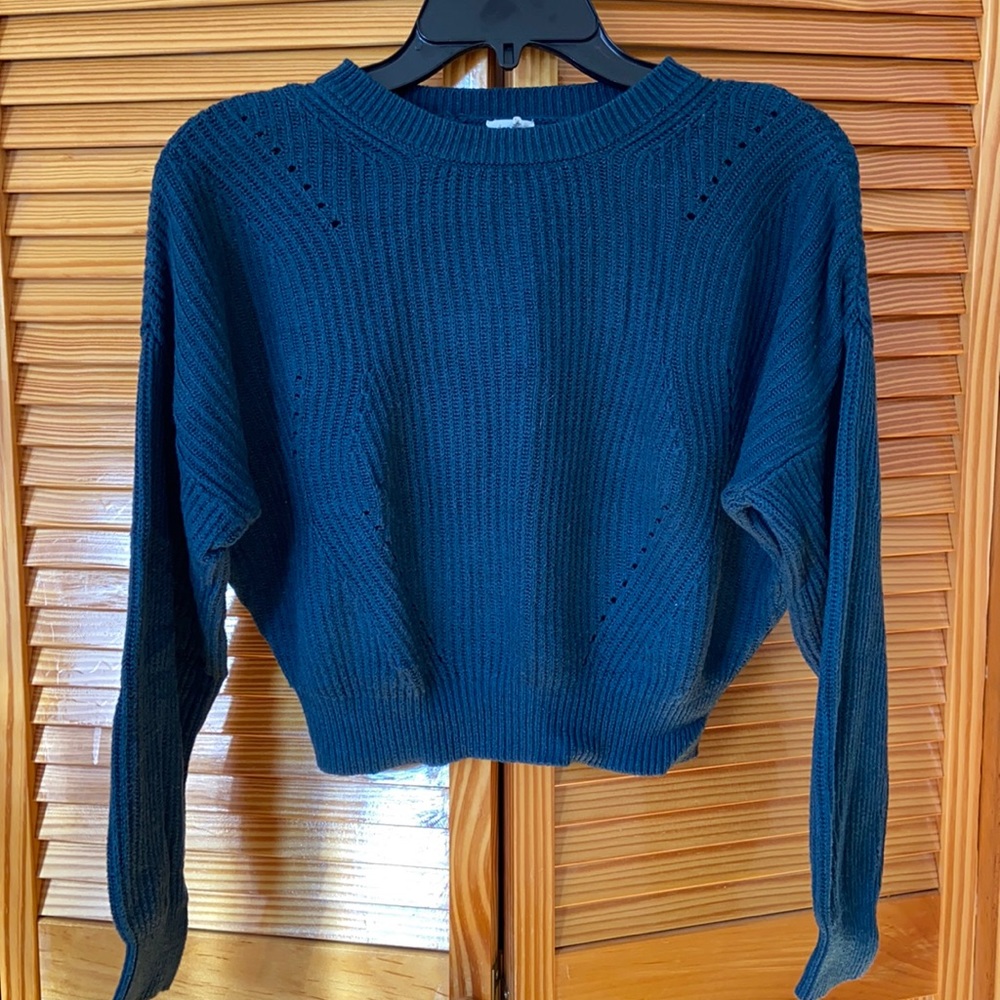 teal colored sweater garage